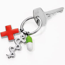 Load image into Gallery viewer, TROIKA Keyring - Keep Well with 3 Charms: Rod of Asclepius, Red Cross, Pill
